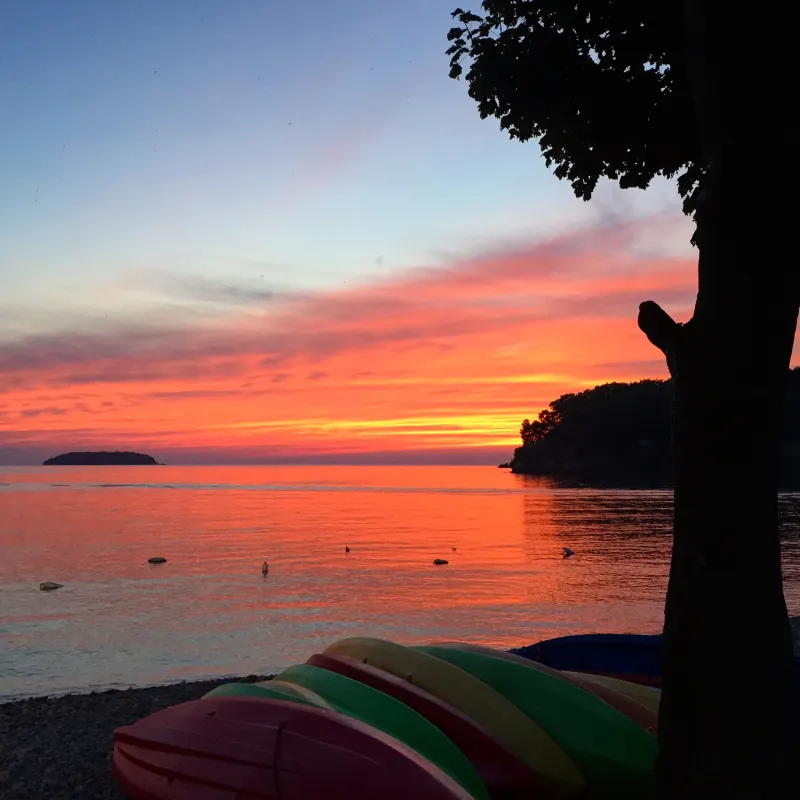 a sunset over a body of water